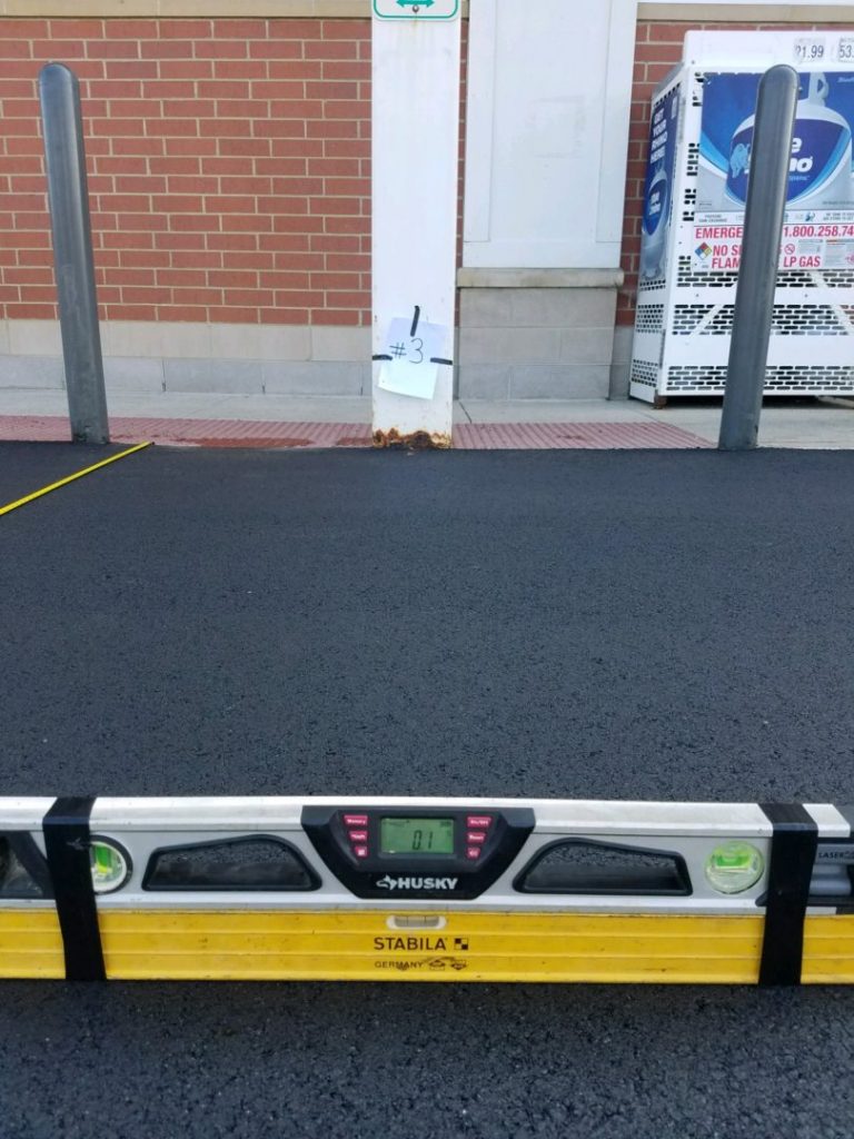 Accessible parking space and access aisle paved and graded by Young's Excavating & Paving LLC, New Hampshire, photo 1 of 5
