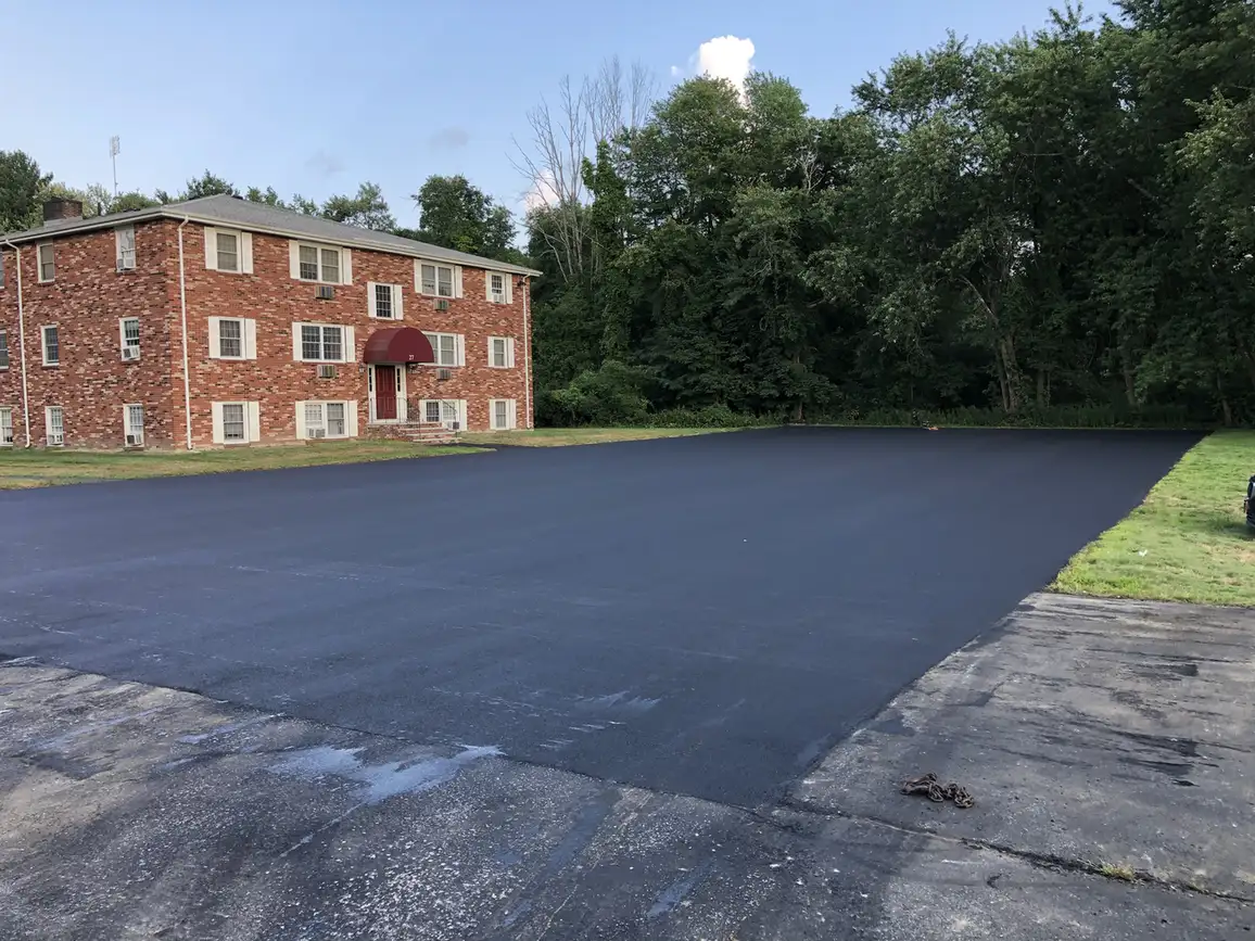 Newly paved apartment parking lot in Salem, NH by Young's Excavating & Paving LLC