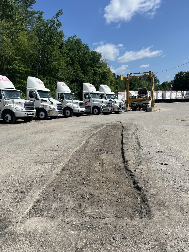 Commercial paving in Concord, NH: a failed section of a parking lot cut out to the gravel sub-base before rebuilding and paving, Young's Excavating & Paving LLC, 37 Washington St, Penacook, NH.