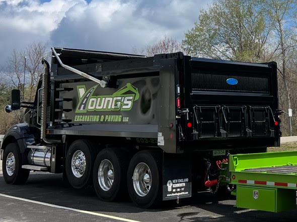Young's Excavating & Paving LLC dump truck with the company logo, Penacook NH